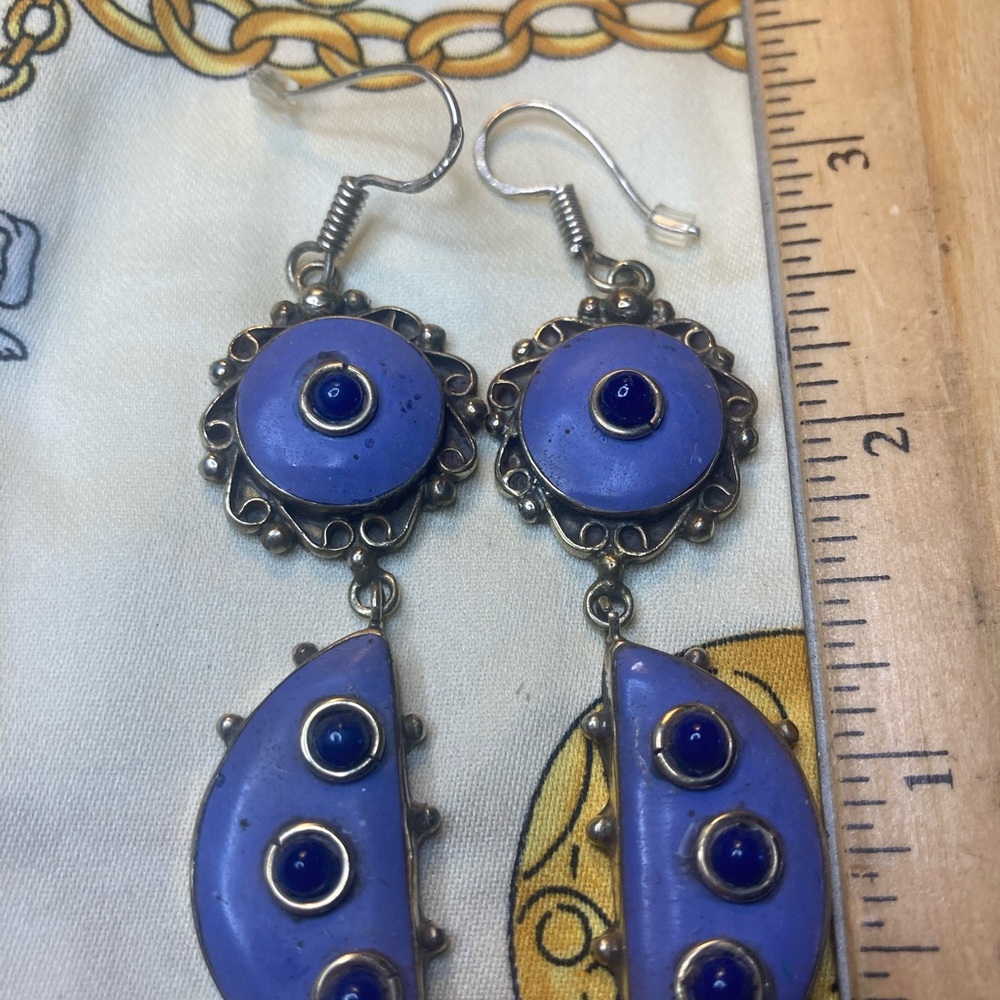 Silver earrings.